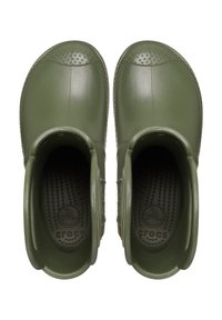 Crocs verdi in gomma con una superficie liscia, punta rotonda e design perforato nella parte anteriore. Presentano un logo all'interno e uno stile slip-on.