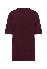 Suéter corto burdeos de manga corta con un corte relajado, cuello redondo acanalado y tela suave y texturizada. Color sólido simple sin estampados.