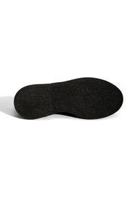Black rubber shoe sole with a textured surface, rounded shape, and smooth edges. Features a flat profile and subtle curvature at the toe.