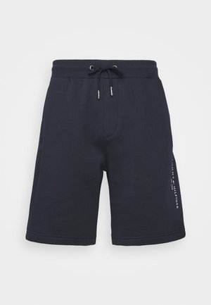 Short bleu marine avec cordon, taille élastique et texte de logo latéral, fabriqué en tissu doux, présenté sur fond blanc.