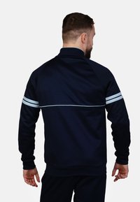 Produktbild von Sergio Tacchini Herren Orion Trainingsanzug, Blau