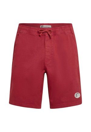 Red swim shorts with an elastic waistband and adjustable drawstring. Features a side pocket and a logo patch on the lower left leg.
