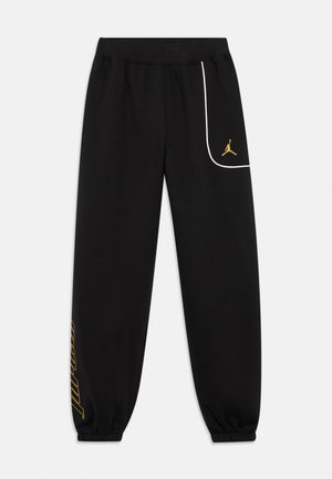 Schwarze Sweatpants mit elastischen Bündchen, ausgestattet mit einer weißen Akzenttasche und goldenem Jordan-Logo, gefertigt aus weichem, atmungsaktivem Stoff.