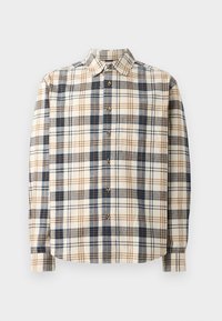 Geplaid blouse in crèmekleur, marineblauw en bruin. Katoenen stof, lange mouwen, puntige kraag, en houten knopen langs de voorkant.