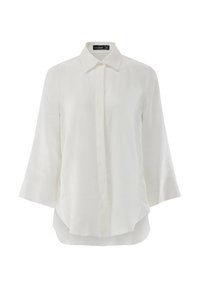 White linen blouse with a pointed collar, button front, and three-quarter sleeves. Smooth texture and a relaxed, loose fit.