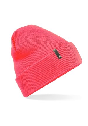 Pink knit beanie with a folded cuff. Ribbed texture and a small black label with a star accent on the side. Soft, stretchy material.