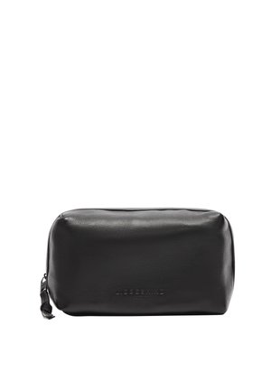 Pochette cosmetica in pelle nera con forma rotonda, texture liscia e logo del brand impresso sul davanti. Chiusura con cerniera nella parte superiore.