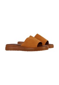 Tan suède slidesandalen met een open teen en een zachte textuur, met een gebogen vorm en een gestructureerde bruine buitenzool.