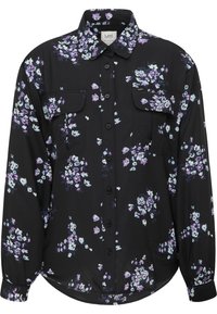 Svart skjorta med krage och blommönster i lila, vitt och ljusblått. Har två bröstfickor och långärmar. Mjuk tyg.