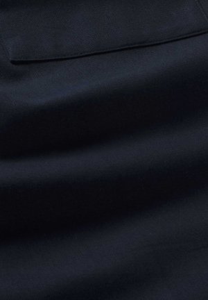 Navy blue fabric, smooth texture, slight sheen, featuring a horizontal seam and single pocket detail. Soft, woven material pattern.