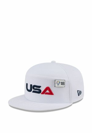 White cap featuring raised "USA" in navy and red, textured fabric, and a side logo patch with "18." Flat brim design.