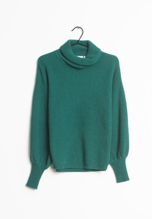 Pull à col roulé tricoté couleur sarcelle avec de longues manches bouffantes et des poignets côtelés, suspendu à un cintre noir sur un fond blanc.