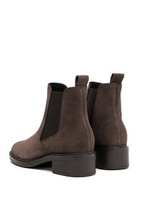 Brown suede ankle boots with elastic side panels, a rounded toe, and a textured block heel. Includes pull tabs for easy wear.