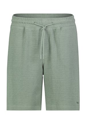 Light green textured fabric shorts with elastic waistband and front drawstring, calf-length, small logo patch on lower right leg.