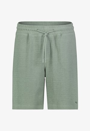 Light green textured fabric shorts with elastic waistband and front drawstring, calf-length, small logo patch on lower right leg.