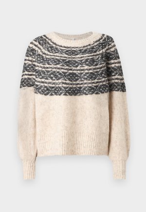 Cremefarvet og sort strikket sweater med mønstret yoke, ribbede manchetter og kant, præsenteret mod en ensfarvet baggrund.