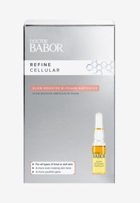 Il packaging argentato mostra "Doctor Babor Refine Cellular", presentando un flacone trasparente con un liquido arancione a due fasi. Il testo evidenzia i benefici per la pelle.