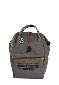 Gray fabric backpack with a textured finish, featuring a front zip pocket, logo patch, gold zipper, and ship graphic design.