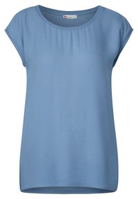 Vaaleansininen lyhythihainen paita, joka on valmistettu pehmeästä kankaasta. Paidan kauluksessa on pyöreä muoto ja se on rento istuvuus. Pintakuvio on sileä, jossa on hienovaraisia ompeluyksityiskohtia.