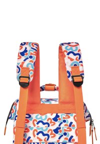 Multicolored backpack with abstract shapes in blue, orange, and red. Made of fabric, featuring adjustable straps and zippers.