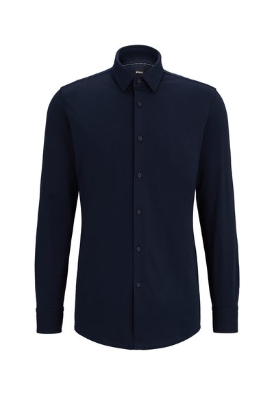 Chemise à manches longues bleu marine, boutonnée, en tissu tissé, avec un col classique, une coupe droite et une fermeture à boutons sur le devant.