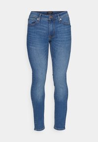 Smala jeans i medelblå denim, med en klassisk femficksdesign, knappgylf och subtila blekningar på låren.