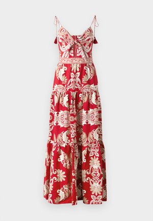 Maxi dress in red with a floral pattern in cream. Features adjustable straps, a bow detail, and a tiered skirt. Lightweight fabric.