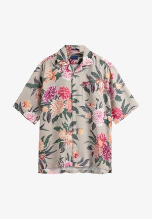 Béžová krátká košile s knoflíky, potiskem velkých květin v růžové, červené, oranžové a bílé barvě a zelenými listy, s náprsným kapsou.