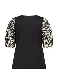 Haut noir à manches courtes avec manches bouffantes en tissu à motif floral blanc. Texture douce avec un col rond. Vue arrière présentée.