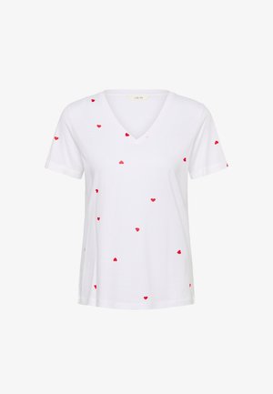 Tricou alb de bumbac cu decolteu în V, decorat cu inimioare roșii răspândite pe întreaga țesătură. Mâneci scurte, croială lejeră.