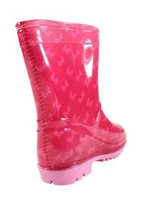 Botte de pluie translucide rose vif avec un motif de nœuds roses plus clairs et une semelle rose unie à crampons.