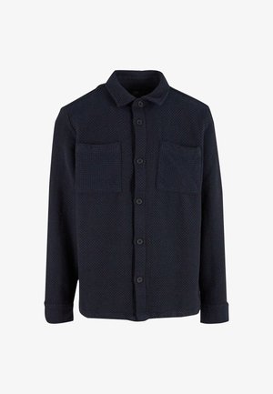Navy blue button-up shirt made of textured fabric, featuring two chest pockets, a standard collar, and long sleeves with buttoned cuffs.