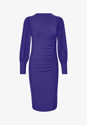 Lilla õhkuva kleit pika puhviga varrukatega, volditud külgede detailidega ja sujuva tekstuuriga. Kuni põlveni ulatuv lõige ja ümmargune kaelus.