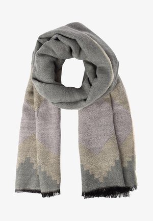 Écharpe douce en tissu tissé avec un motif géométrique dans des nuances de gris, beige et lavande, avec des bords frangés noirs.