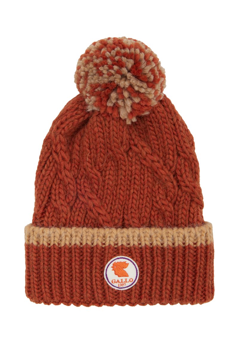 Knit beanie in orange and beige wool, featuring a cable pattern, a fold-over brim, and a pom-pom on top with a logo badge.
