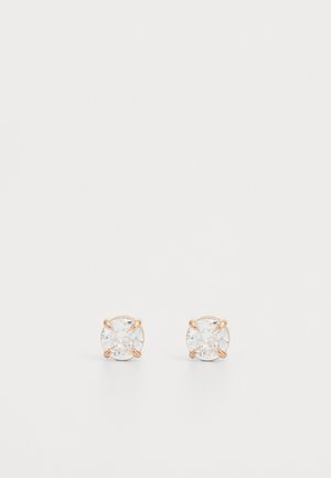 Gold-tone metal stud earrings featuring round clear crystals, set in a four-prong design, with a smooth finish and polished surface.