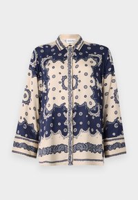 Navy and cream patterned blouse in smooth fabric; features long sleeves, a collared neck, buttons, and intricate paisley designs along cuffs.