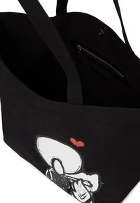 Czarna torba płócienna z szerokimi uchwytami, z białą postacią z kreskówki i grafiką czerwonego serca. Zawiera wewnętrzną kieszeń zapinaną na zamek.