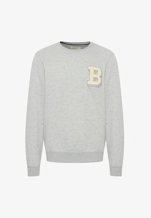 Harmaa collegepaita, joka on valmistettu pehmeästä puuvillasekoitteesta. Pyöreä pääntie, ribbaatut hihansuut ja helma, vasemmassa rinnassa vaaleanbeige kirjailtu "B".