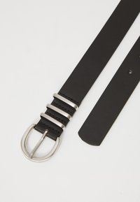 Black leather belt with a shiny silver buckle, featuring three horizontal metal accents and a smooth finish on the strap.