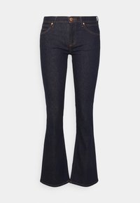 Jean flare en denim bleu foncé avec une taille ajustée, conception à cinq poches et couture orange contrastante. Comprend une fermeture à bouton et sans embellissements.