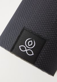 Navy textured fabric tote featuring a black tag with a white logo, highlighting a smooth finish and structured shape.