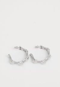 Atlasīts, antique silver-coloured