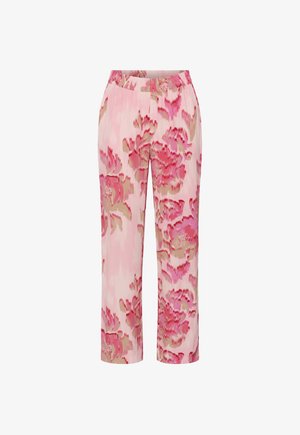 Pantalon rose avec une taille élastique arborant un motif floral audacieux dans des nuances de rose et de beige.