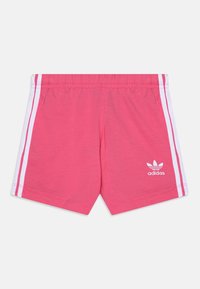 Pink athletic shorts made of cotton blend fabric. Features white side stripes and an Adidas logo on the bottom left corner.