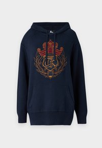 Sweat à capuche en coton bleu marine avec un motif brodé de couronne et de laurier en rouge et or. Comprend une poche avant et des poignets côtelés.
