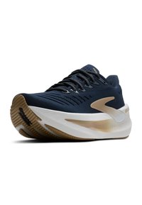 Navy running shoe with a textured upper, lace closure, and a white midsole. Features a gold accent and rubber outsole with a patterned tread.