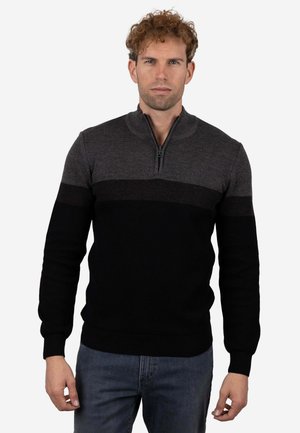 Jersey de hombre, diseño con media cremallera, presenta un patrón de bloques de color en gris y negro. Textura de punto, puños y dobladillo acanalados, ajuste casual.