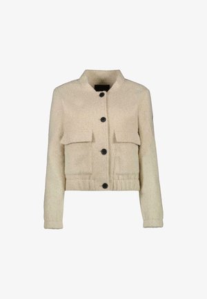Crème-kleurige cropped jas van textuurstof, met een drukknoopsluiting en twee grote voorzakken.