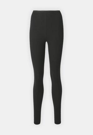 Svarta leggings i stretchigt material, med hög midja, skräddarsydd passform och utan synliga sömmar eller mönster.